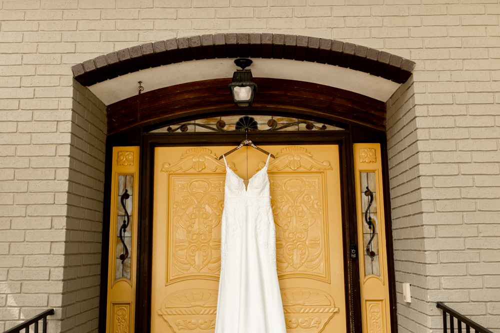 Wedding dress hanging at conrad mansion