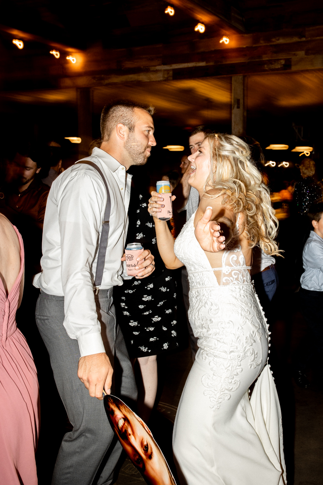 Bride and groom let loose and have fun during their wedding reception! 
