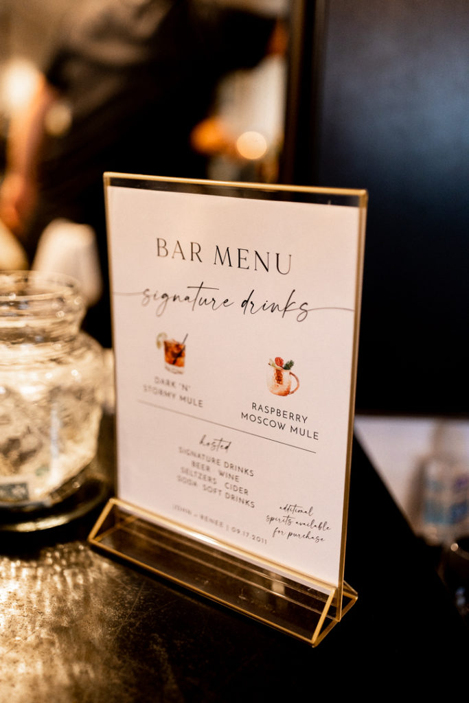 Bar menu is printed with the bride and groom's signature drinks. 