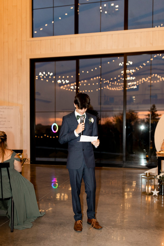 More wedding speeches from members of the bridal party. Gorgeous photo captures the beauty of the wedding venue Little Lights on the Lane in West Branch, Iowa. 