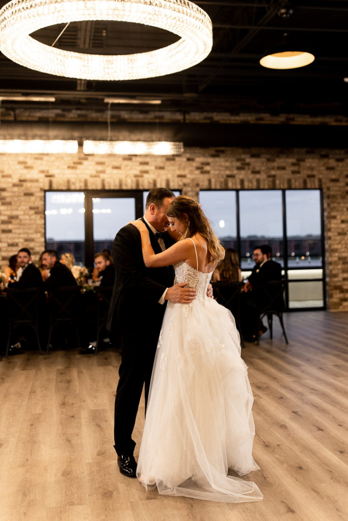 Bride shares a dance with her dad during father daughter dance. Special moments captured by Iowa Wedding Photographer. 