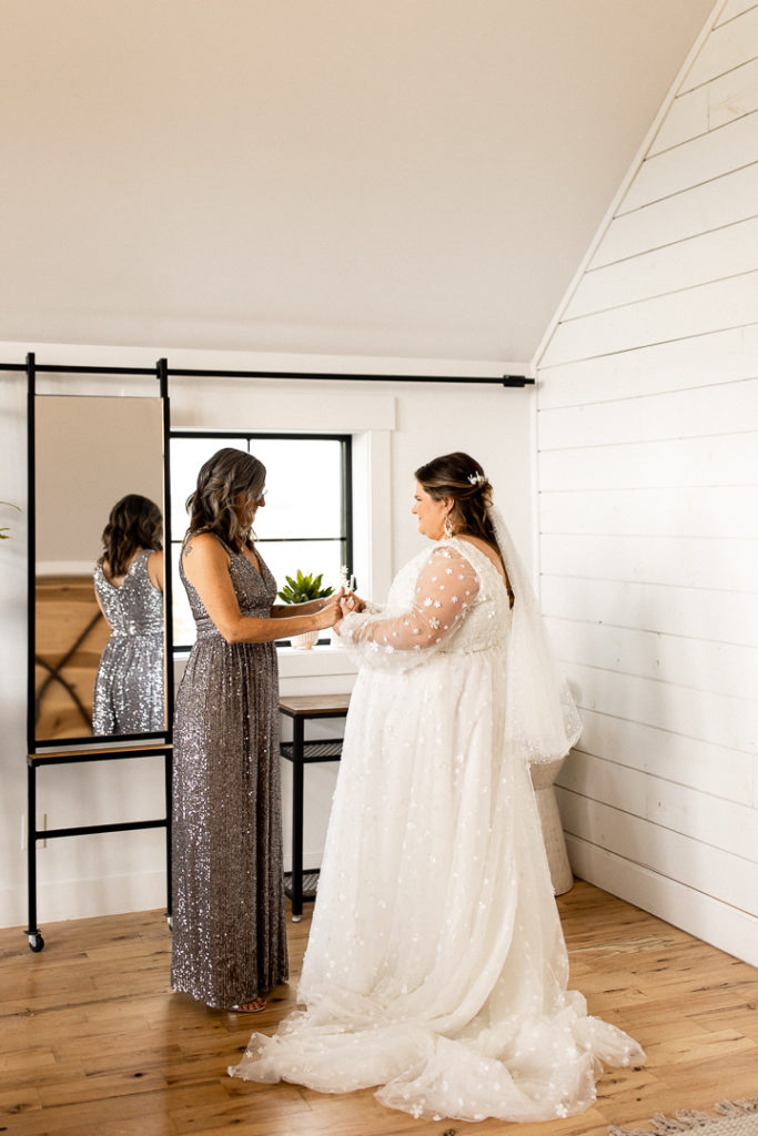 Sweet moments shared between the bride and her mom. Treasured moments of the wedding day captured by Iowa Wedding and Lifestyle Photographer. 