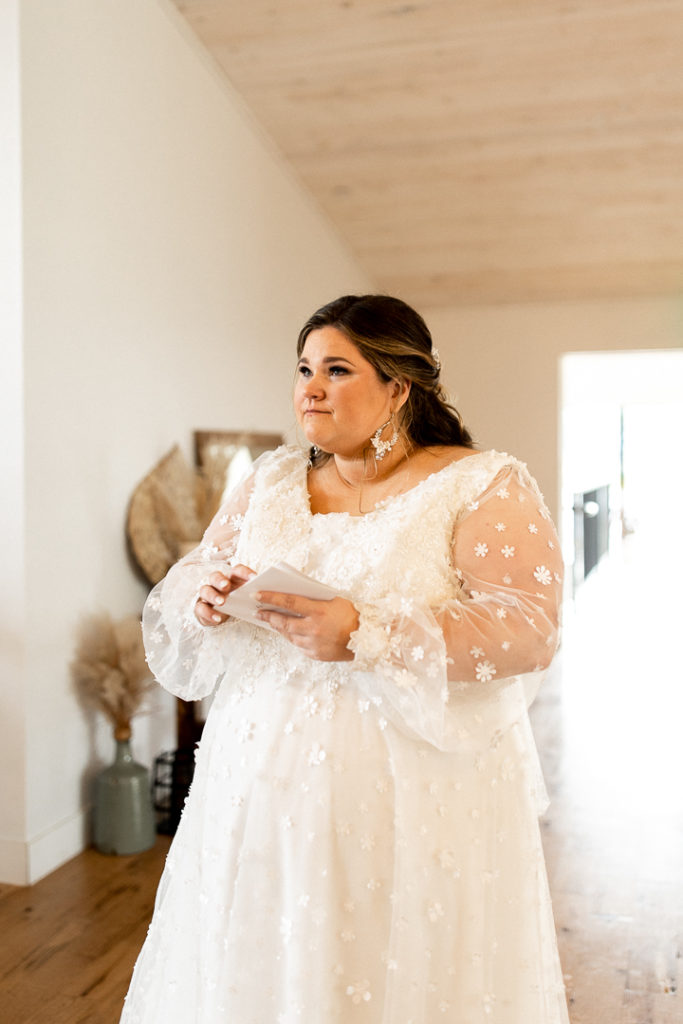 Bride chokes back tears as she reads letter from her groom on the day of her wedding. 