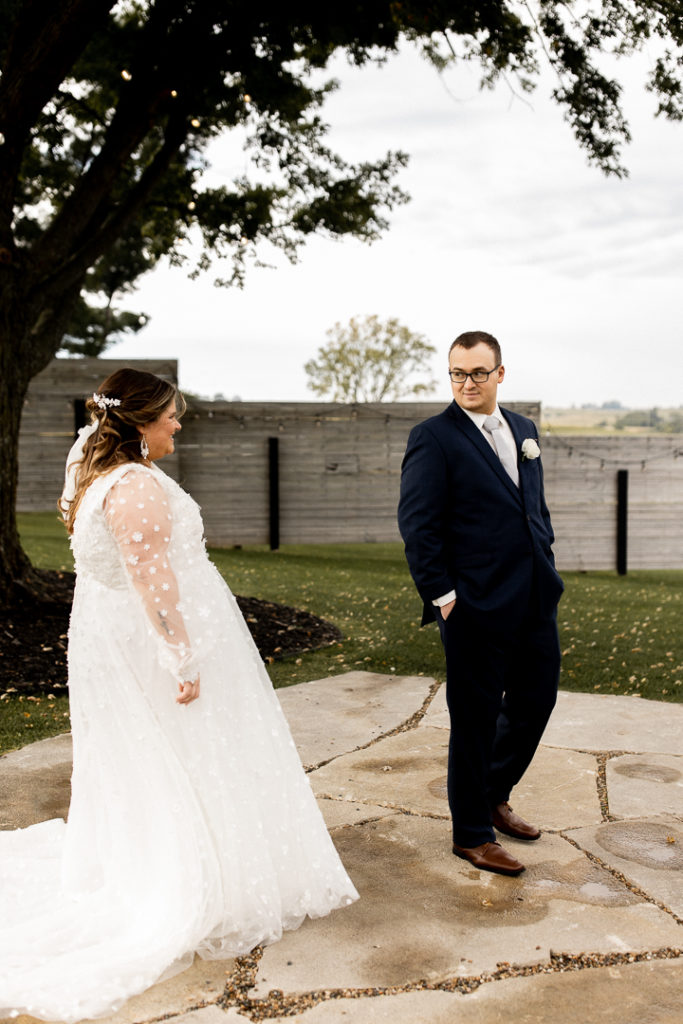 Groom turns around to see his bride for the first time on their wedding day. 